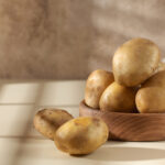 Raw potatoes in a bowl. The concept of harvesting, organic food.