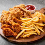 fried chicken with french fries and nuggets meal