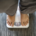 Woman standing on a scale